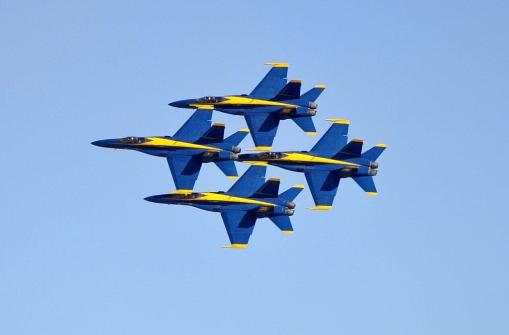 Blue Angels precision flying team demonstrating teamwork and coordination