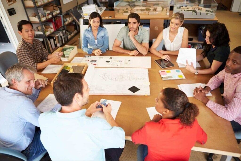 Creative team brainstorming in a collaborative meeting environment.