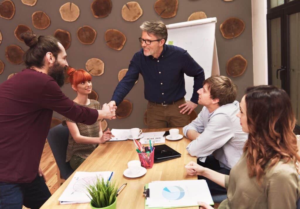 Team collaborates effectively during a productive meeting, fostering positive interactions and ideas.